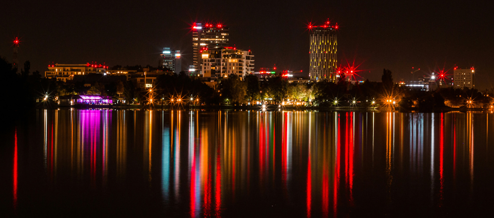 Bucharest Night Skyline by Liviu Emanuel on Unsplash