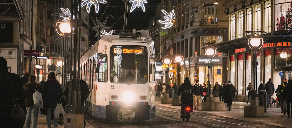 Tram in Nighttime Geneva by Meizhi Lang on Unsplash