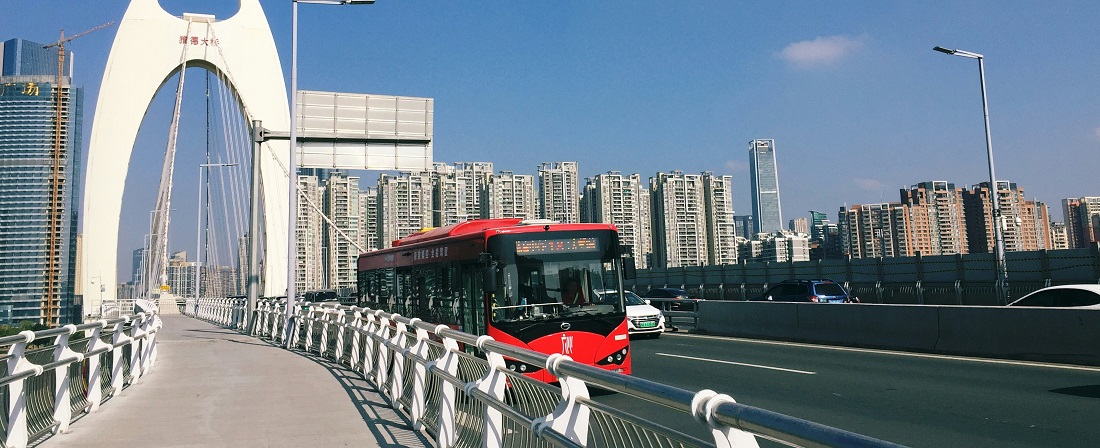 Red bus on the Liede Bridge in Guangzhou by Lycheeart