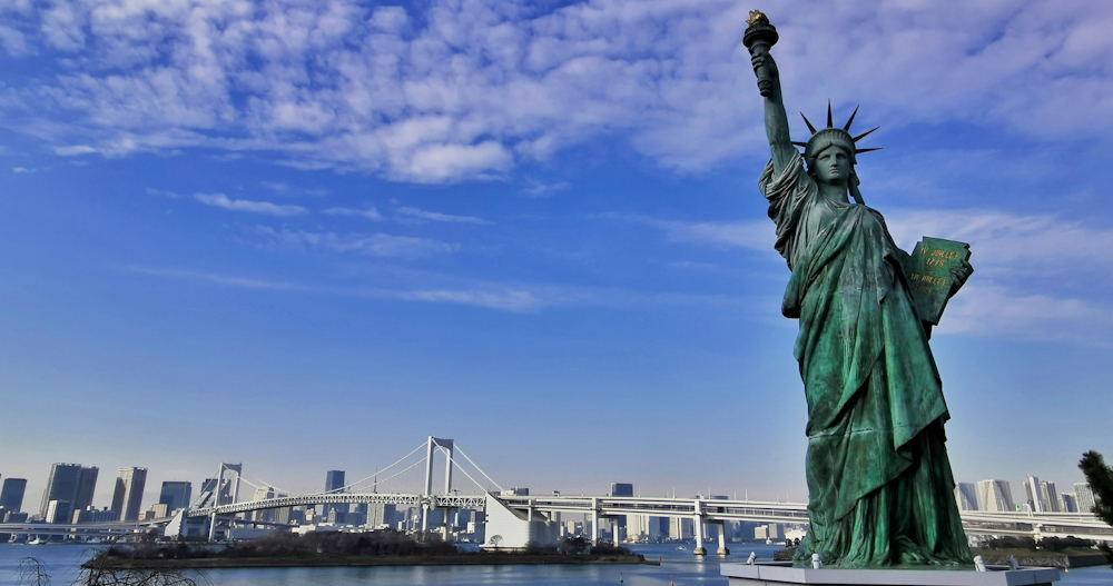 Statue of Liberty and New York Cityscape by Snowscat on Unsplash