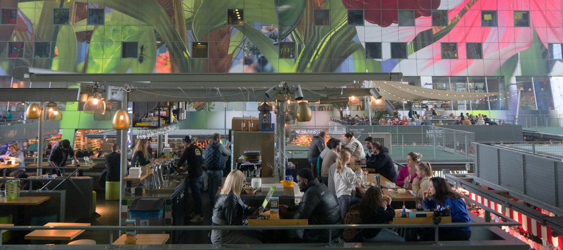 Diners in Markthal by Fons Heijnsbroek