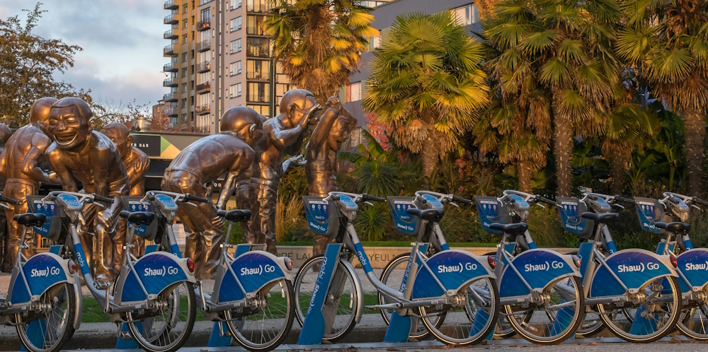Bike Share station by the A-maze-ing Laughter Sculpture in Vancouver by Pierre Jarry