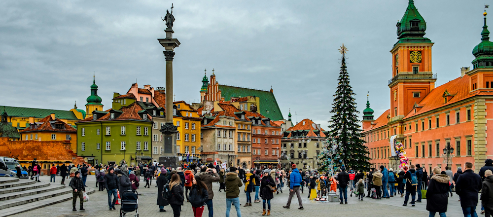 Pedestrians in Warsaw's Castle Square by Elijah G on Unsplash
