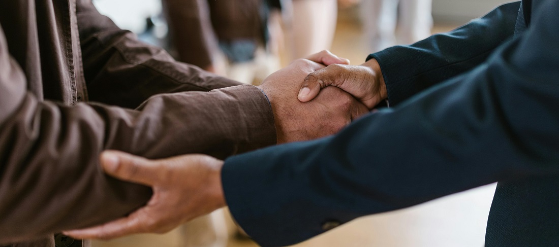 Two men shaking hands by RDNE Stock Project
