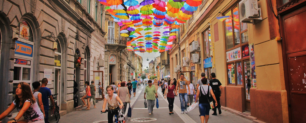 Umbrella Street in Romania by Haseeb Jamil on Unsplash