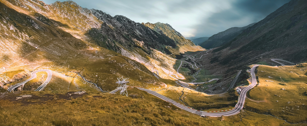 Winding Road in Transfăgărășan, Curtea de Argeș, Romania, by Tiberiu Potec on Unsplash