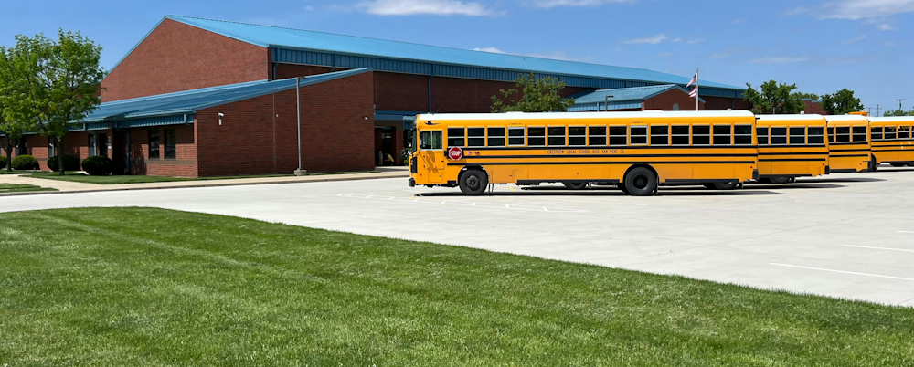 Line of Yellow School Buses by Julia A. Keirns on Unsplash